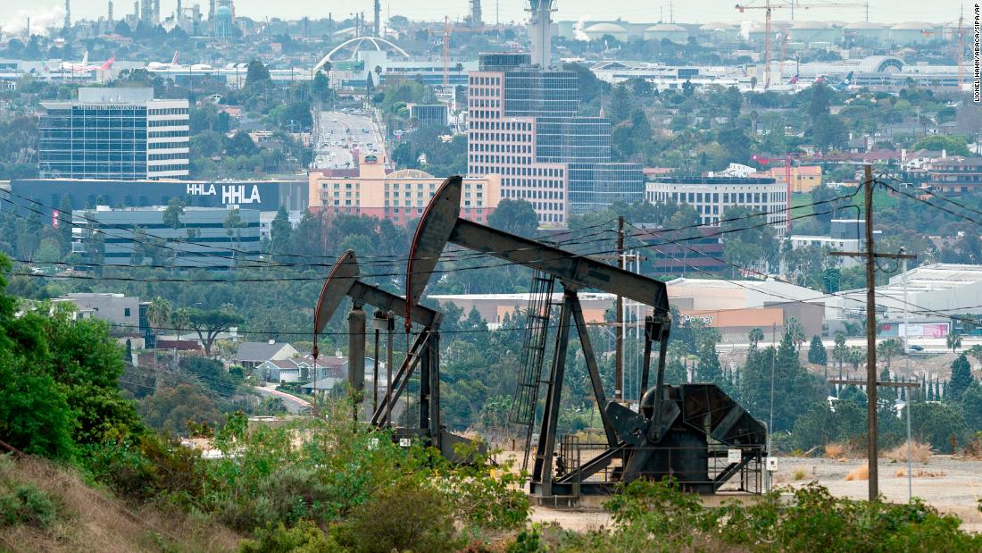 Pump jacks draw crude oil from the Long Beach Oil Field near homes in Signal Hill, California, on March 9, 2020. - Global stocks and oil prices rebounded on March 10, 2020 on hopes of US economic stimulus efforts as the coronavirus rages, one day after suffering their biggest losses in more than a decade. Trading is exceptionally volatile as investors attempt to get a grip on a rapidly changing news flow, with positive reports of progress in China on the virus clashing with a Saudi decision to increase oil output in an already over-supplied market. (Photo by David McNew/AFP/Getty Images)